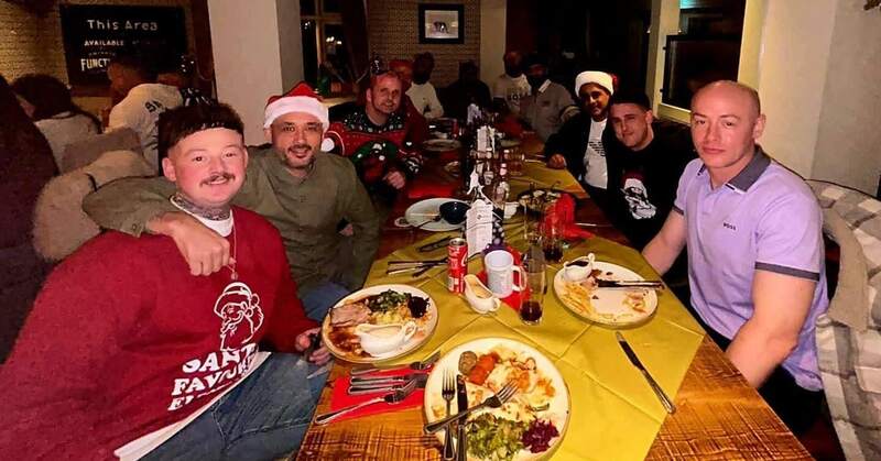 The Seasons team at a long table for Christmas dinner