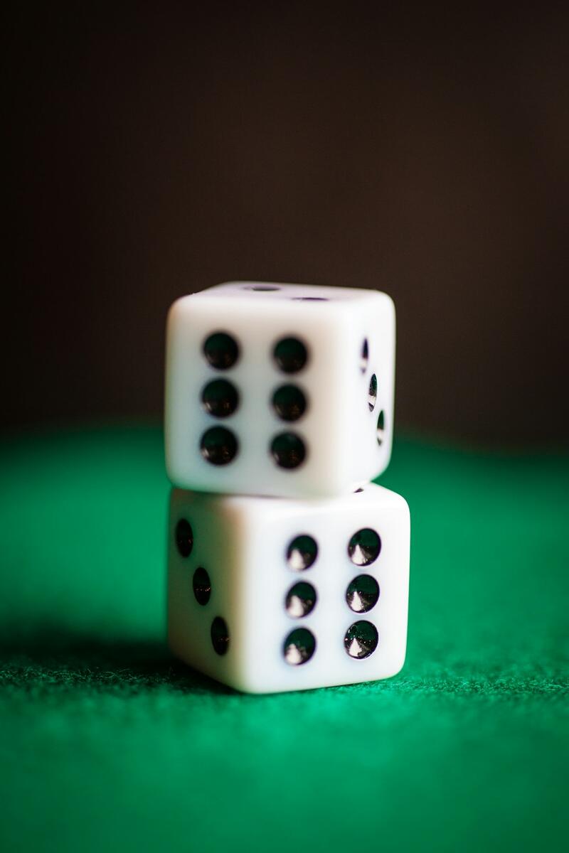 Two dice on a dark table
