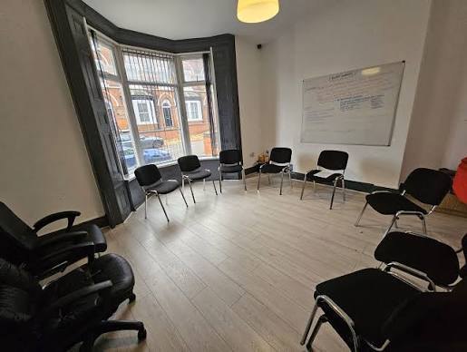 A group room at Seasons Clinic with chairs set out in a circle